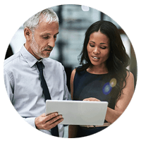 Two people looking over tablet