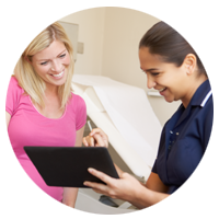 Nurse and patient looking at information on a tablet.