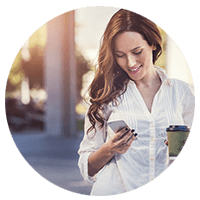 Smiling businesswoman on cellphone outside