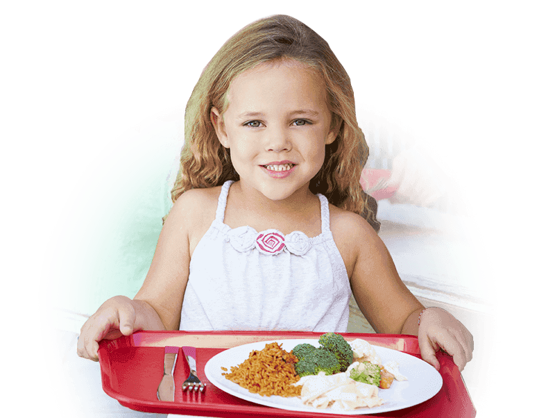 Elementary aged child holding a school lunch