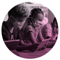 Children using personal computers in a classroom setting. 