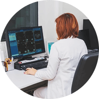 Female Doctor using a desktop computer