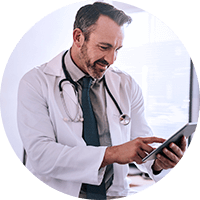 Male doctor using a tablet