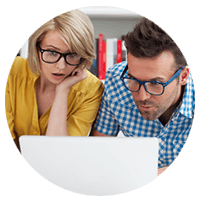 Man and woman working on laptop computer