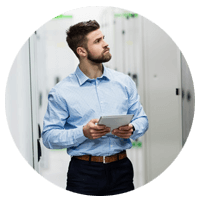 Business man walking through server room