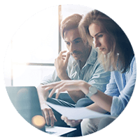 Man and woman learning together on a computer.