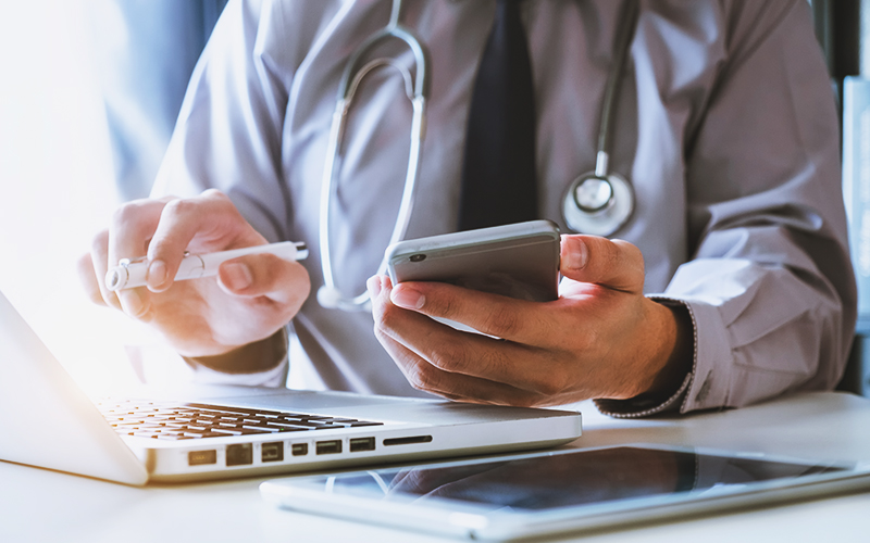 Doctor using laptop