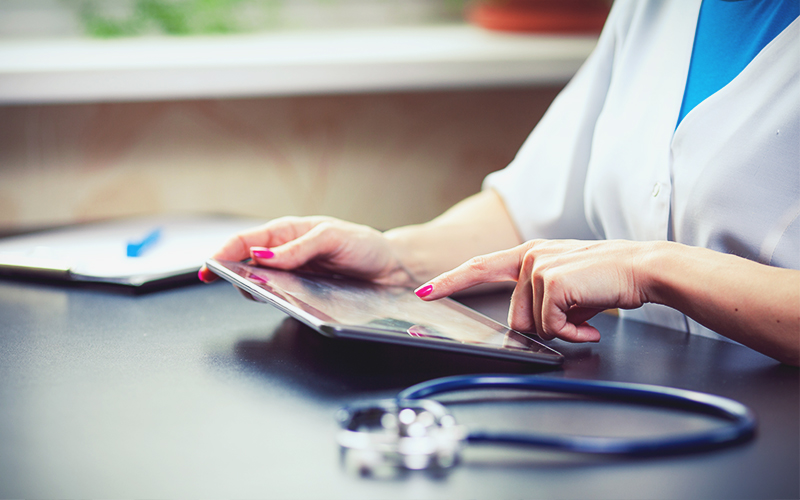 doctor using tablet