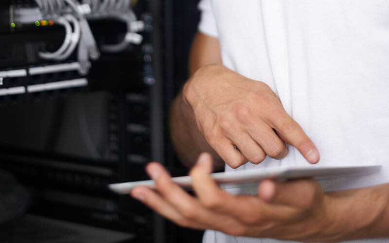 Close up of tablet device in hand