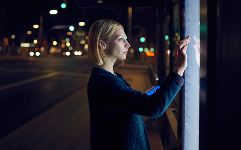 Woman pointing on a touchscreen monitor