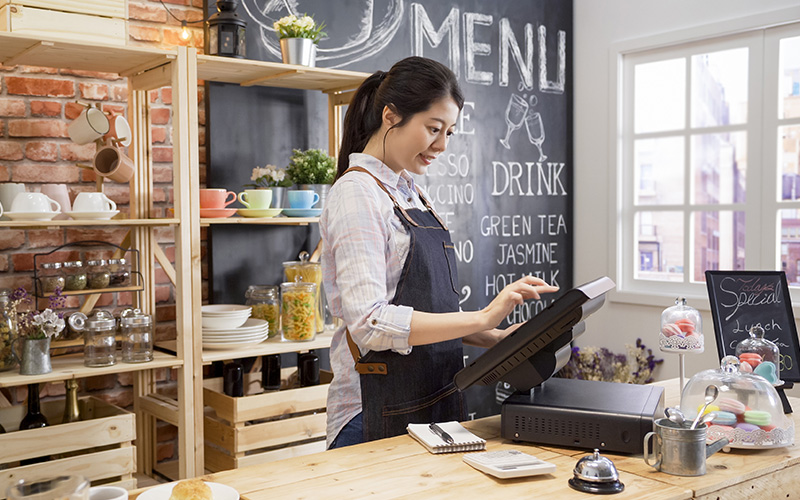 Cashier using POS