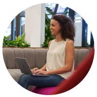 Insight employee working on laptop in open working space