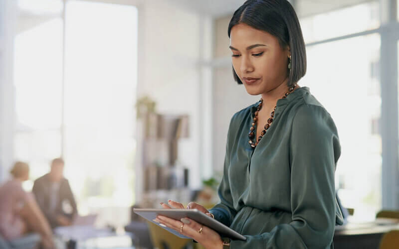 Business woman using tablet in modern office