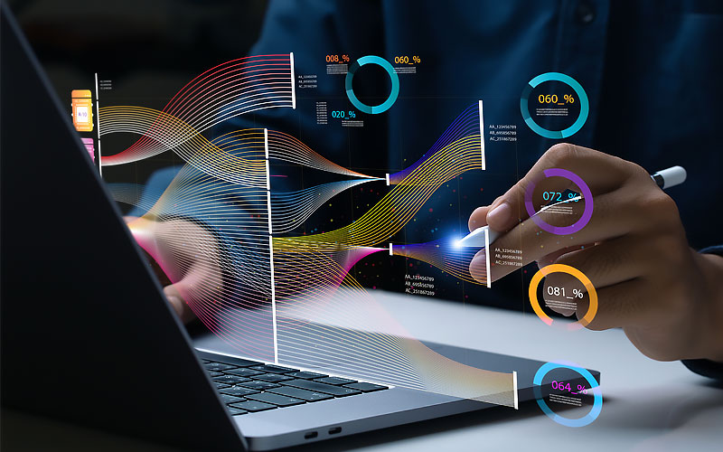 Data analytics concept overlayed on laptop computer