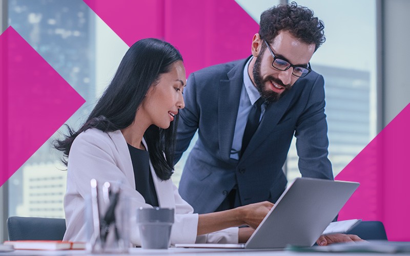 two coworkers accessing the cloud in office