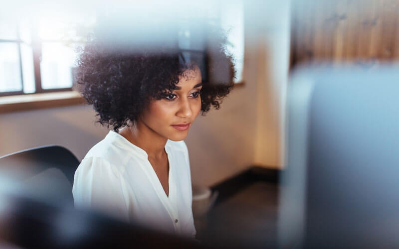 Woman looking at the computer screens