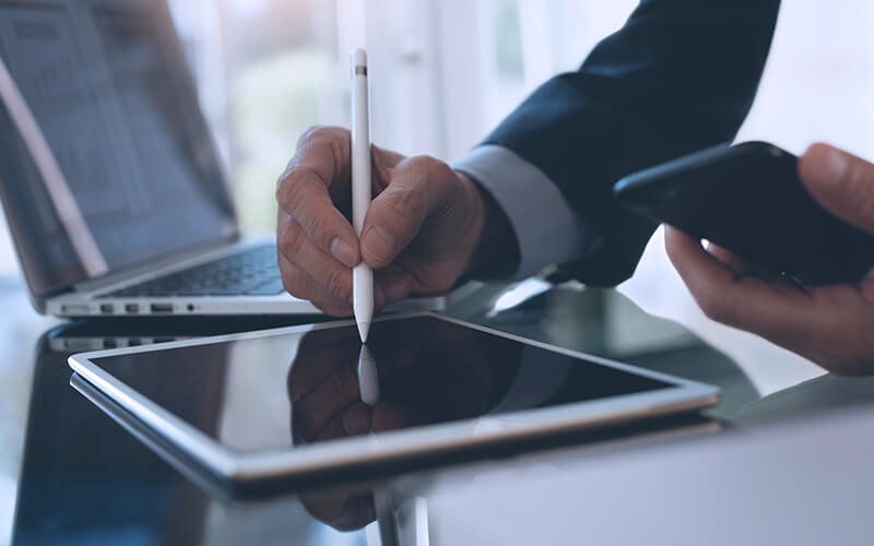 Person signing in tablet