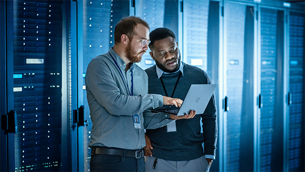 Two businessmen working in data center