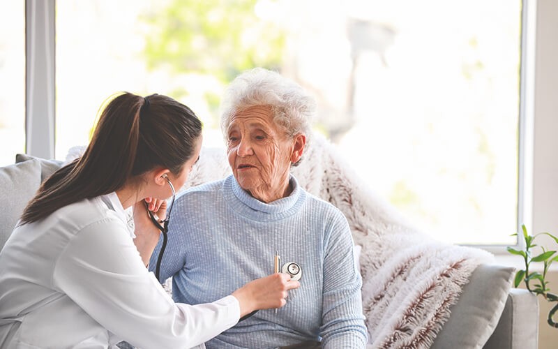 Doctor monitoring the patient at home