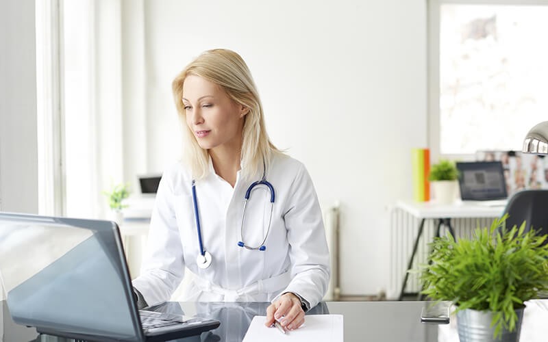 Doctor using a laptop