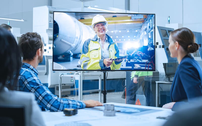 Professional individuals doing a meeting with Samsung display