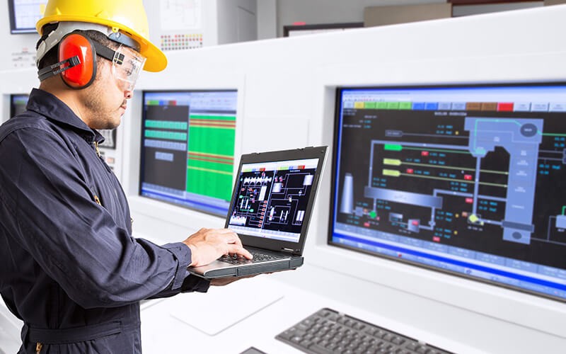 A man working and holding a samsung device