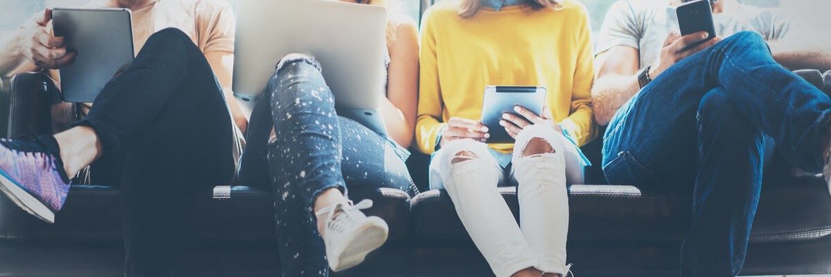 A group of people browsing the internet on their smart devices