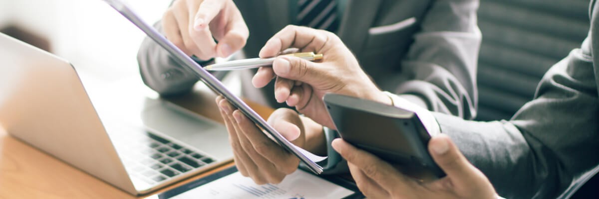 Man digitally signing a document on his tablet