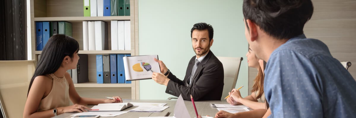 Professional businessman presents a financial chart with his team in the meeting