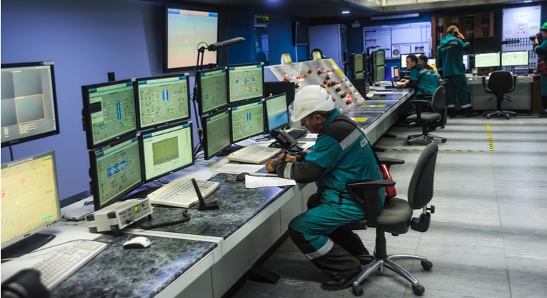 An engineering personnel watch in monitors work of the equipment.