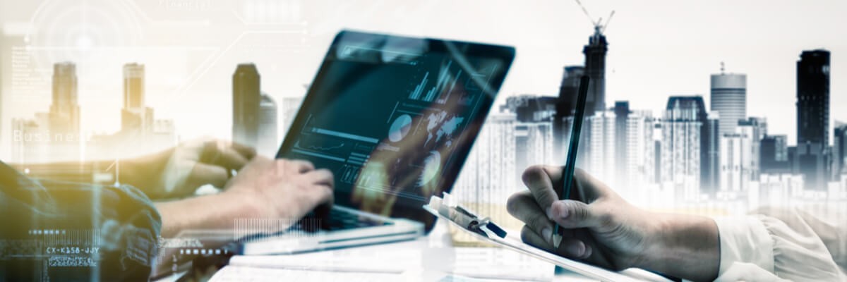 Men working on a laptop and tablet