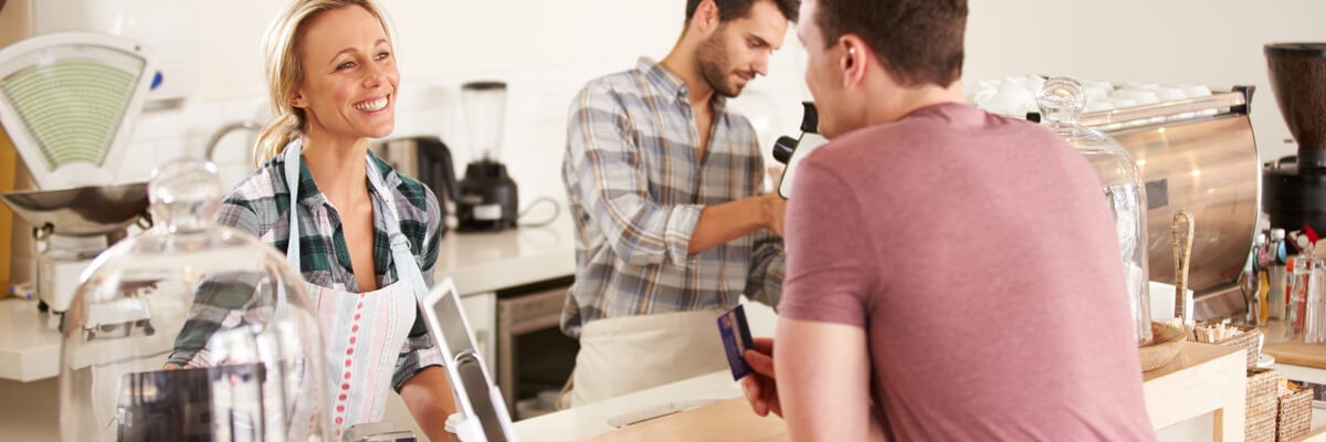 Photo of a man ordering at a coffee shop