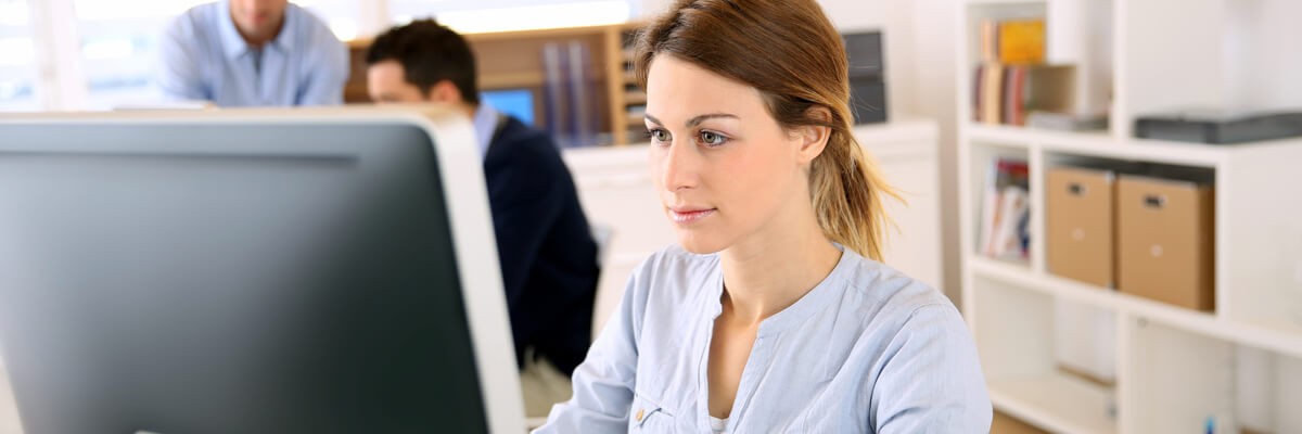 Photo of a small business owner using a desktop computer