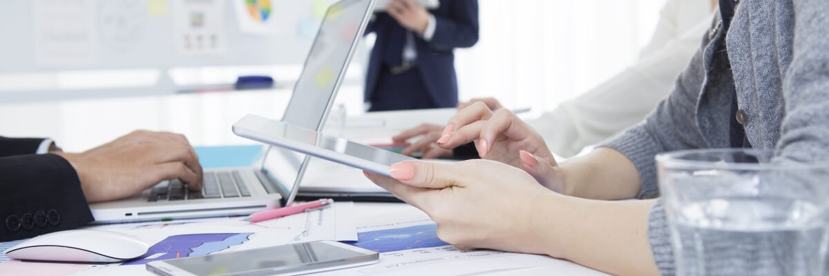 Two people working on devices