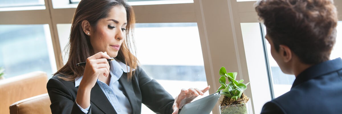 Photo of a professional business woman interviewing someone