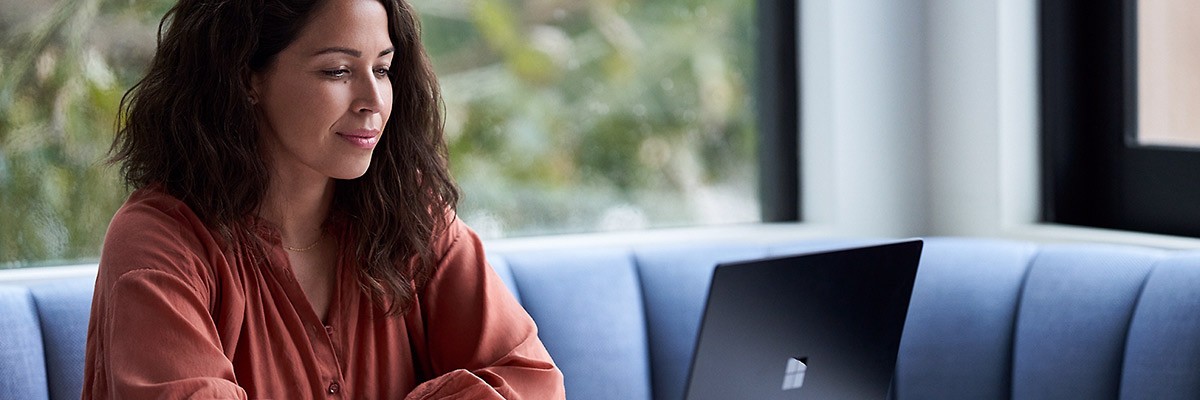 Woman on Microsoft Surface device lifestyle