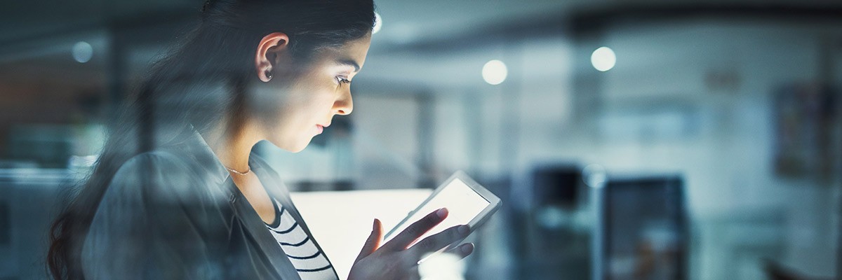 Woman on tablet in office