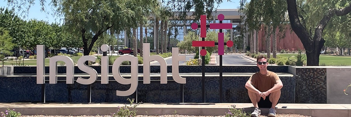 Brocks Jacobs in front of Insight building sign