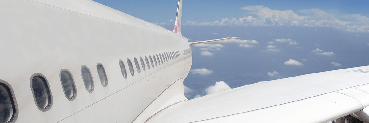 Close up exterior view of an airplane in the sky