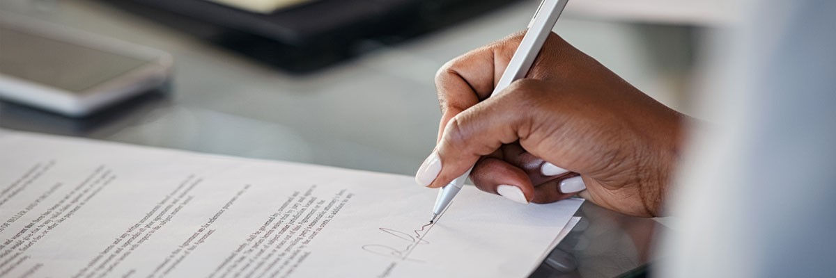 Close up of law firm signing a contract