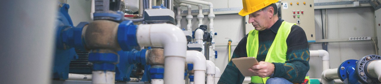 An engineering personnel watch in monitors work of the equipment.