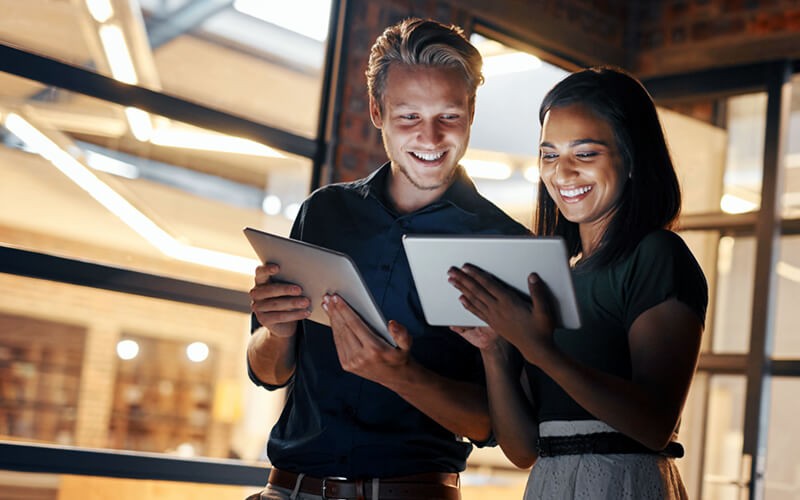 Two business colleagues collaborating on tablet device