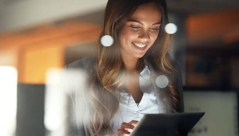 Businesswoman using VMware cloud software on tablet