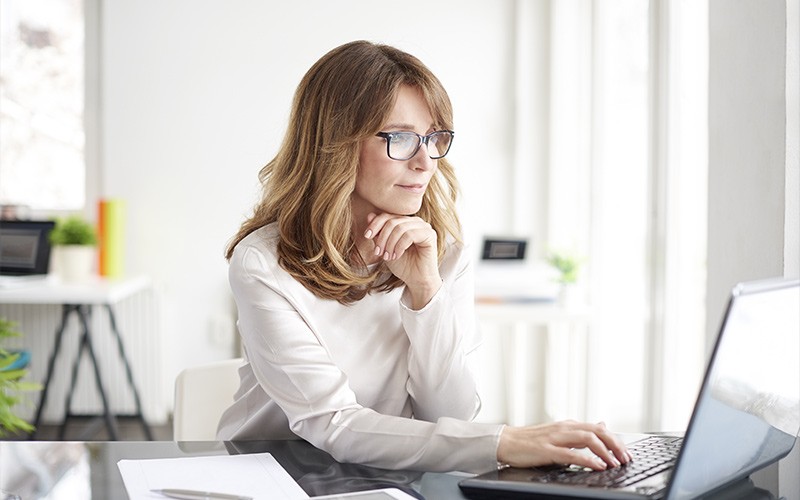 Businesswoman working on laptop computer