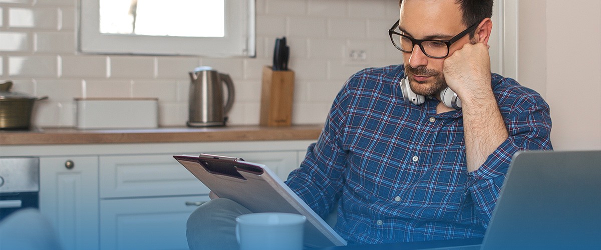 Worried man reading something