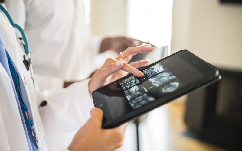 Doctor using tablet