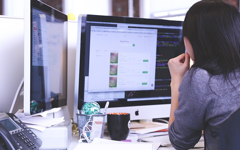 Woman working on a desktop computer