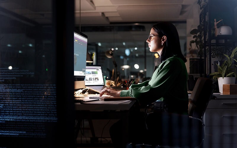 Corporate woman working late at night