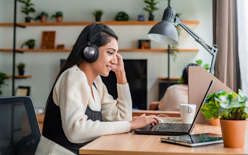 Remote worker using Cisco headset to join Webex meeting