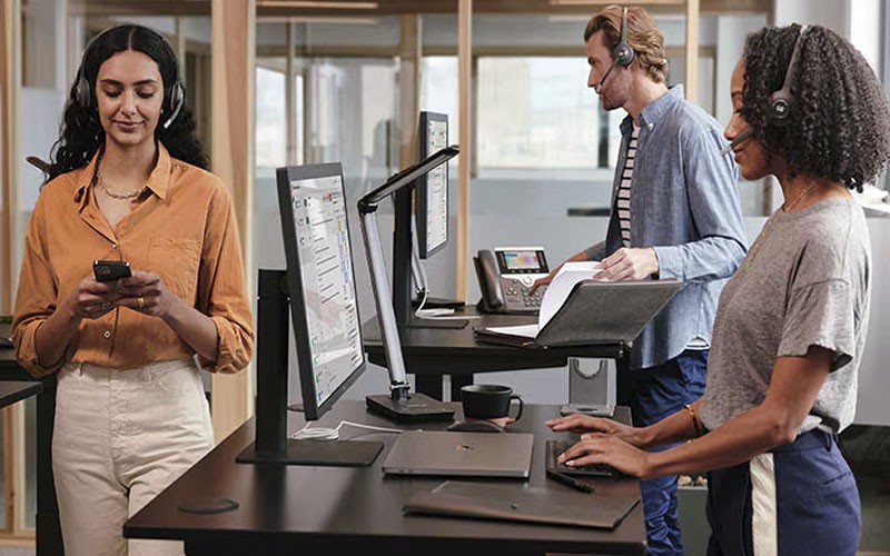 View of workers with headsets working at Cisco Contact Center